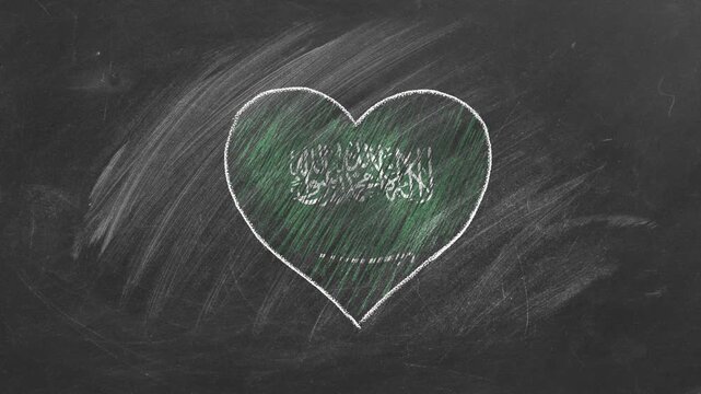 National flag of Saudi Arabia in heart shape  drawn with colored chalk on a blackboard.