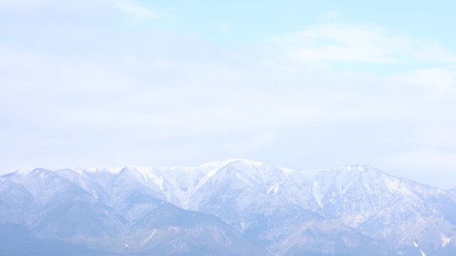Snow covered mountain under winter sky