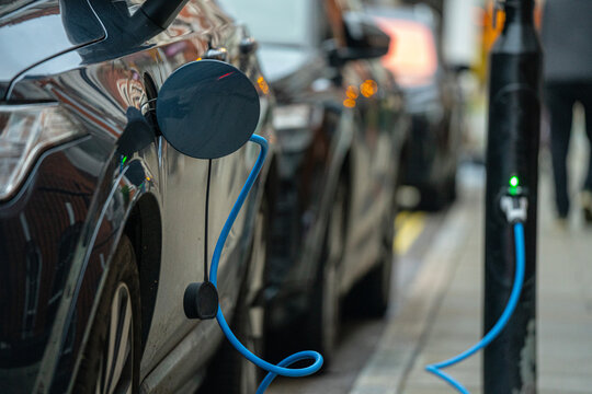 Close-Up Of EV Electric Car Charger, EVSE Connector, Vehicle Inlet, Charging Flap, Street Charge Port In London, UK