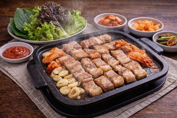 Grilled meat skewers on tabletop grill closeup