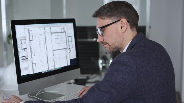 Architect developing building blueprint on computer, engineering and urban planning a new construction project. Business and architecture concept