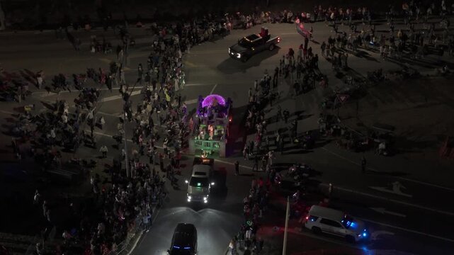 Mardi Gras Parade Float Moving Through Crowded City Street