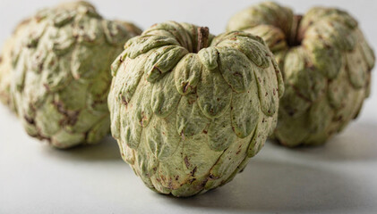 Obraz premium A realistic still life focusing on whole cherimoya fruit as raw natural ingredients.