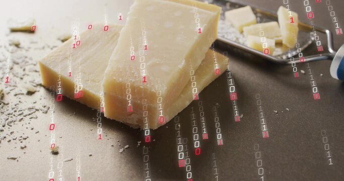 Showing Parmesan wedge shards crumbs sitting on dark counter with metal plane handle binary overlay