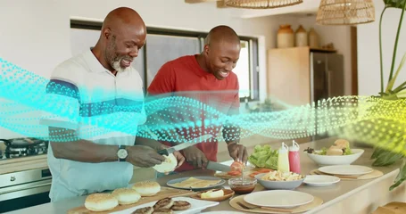 Fotobehang Koken Slicing father, son in light polo and red T-shirt preparing burgers on kitchen island, with buns  © vectorfusionart