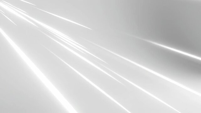 Dynamic streaks of luminous white light zoom across a soft gray backdrop, conveying a feeling of rapid movement and vibrant energy, perfect for abstract backgrounds.