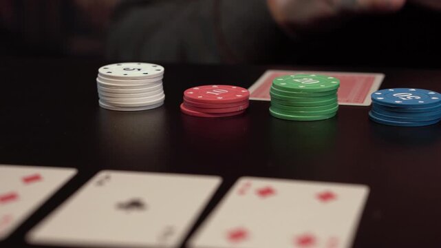 Playing Texas Holdem Poker. Close Up of Card, Hands and Casino Chips