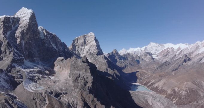 Aerial landscape of Nepal&rsquo;s Khumbu Himalayas featuring Chola Tsho Lake in the Everest region. High-altitude mountain terrain with dramatic views toward towering 8000-meter Himalayan peaks.
