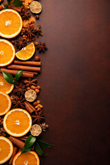 Orange and Winter Spices Flat Lay with Copy Space on Dark Background