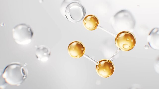 Abstract molecular structure with golden atoms and water drops moving slowly