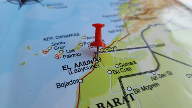 View of Laayoune or El Aaiun, is the largest city of the disputed territory of Western Sahara, on a geographical map of Africa, marked with a red push pin.