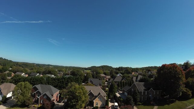 Drone Survey Of Tennessee Suburb, Capturing Brick Homes, Vibrant Fall Canopy, Street Grid, Rolling Hills On Horizon, Clear Blue Sky And Crisp Light, Footage Suited For Planning, Mapping,