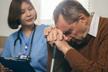 Caregiver&rsquo;s hand on an elderly man&rsquo;s shoulder, symbolizing compassion, support, and trust in senior care.