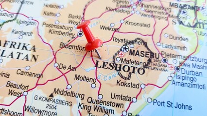 View of Lesotho, formally the Kingdom of Lesotho and formerly known as Basutoland, is a landlocked country in Southern Africa, on a geographical map of Africa, marked with red pushpin