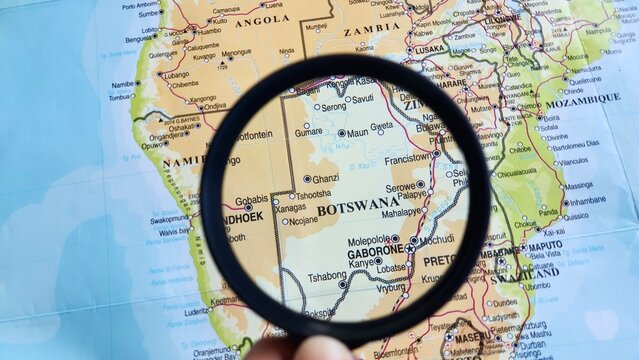 View of Botswana, on a geographic map of Africa, seen using a magnifying glass