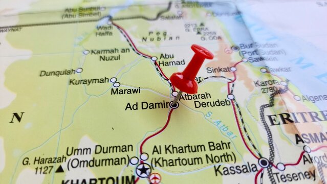 View of Ad-Damir or ad-Damar is the capital of the River Nile state in Sudan, on a geographical map of Africa, marked with a red pushpin.