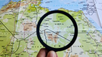 View of Libya, on a geographic map of Africa, seen using a magnifying glass