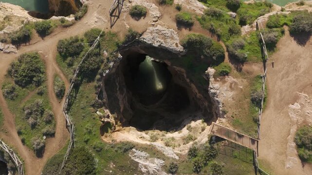Aerial View Of Portim&atilde;o Gruta Das Baratas Algarve Coastline Portugal Cliffs Caves Ocean Greenery And Sandy Beaches From Above. Rising Shot