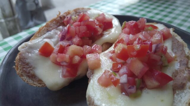 Delicious cheese tomato molletes for breakfast