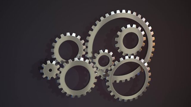 Industrial metal gears rotating in synchronized motion loop representing mechanical engineering and teamwork process