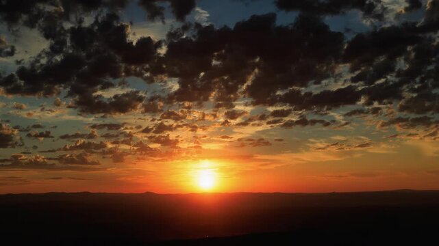 Inspirational Sunset with Sun and Clouds Zoom Out Timelapse