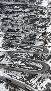 Los Caracoles highway road near Santiago Chile in aerial view. Snow highway road. Vertical video