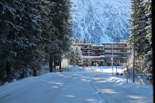 Sunny snowy road in Arosa, Switzerland