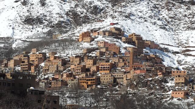SET OF BUILDING ON WHITE MOUNTAIN DURING WINTER IN IMLIL MOROCCO.