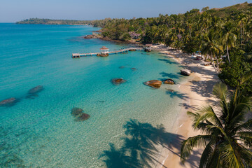Fototapeta premium Ao Noi Beach in Koh Kood, Thailand invites relaxation and adventure under the sunny tropical sky