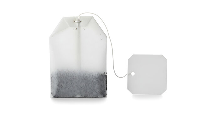 Single tea bag with tag on white background