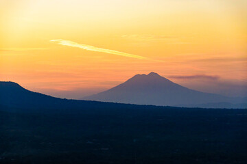 Serene Mountain Landscape with Dramatic Sunset Sky in the Distance. Chinchontepec volcano. © Mario