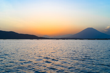 Serene Lake at Dusk with Mountain Backdrop Landscape Scenery © Mario