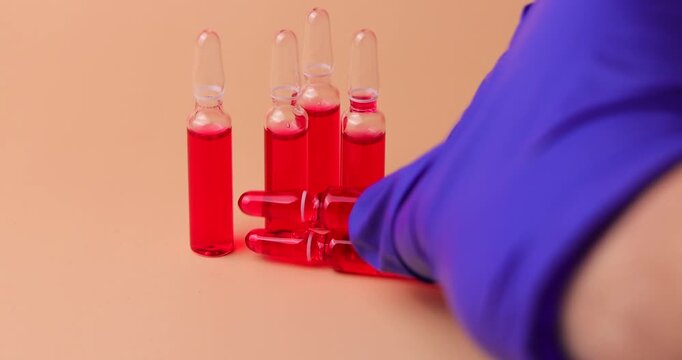video of b12 injection Injectable B12 vials with red tablets and a syringe. Ideal for representing  clinical nutrition, health supplements and professional wellness footage