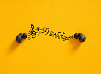 Listening to music. Wireless earbuds playing musical notes on yellow background