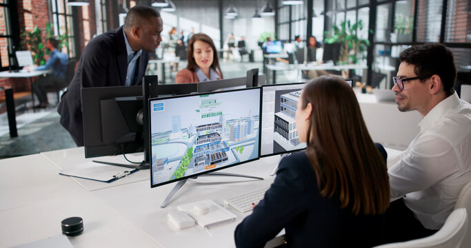 Engineers On GIS Team Using Design Software