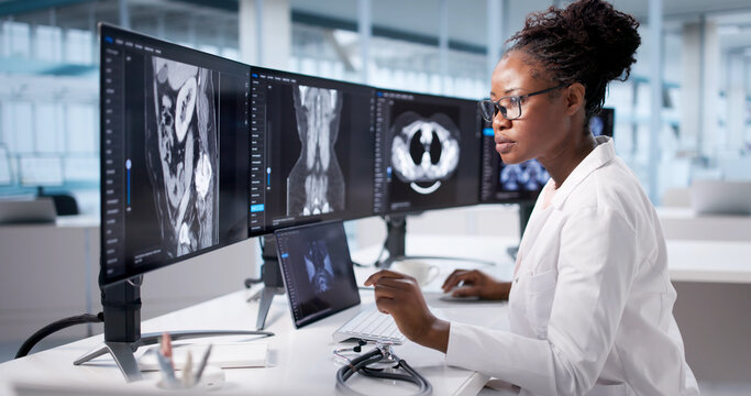 Surgeon Analyzing MRI Results