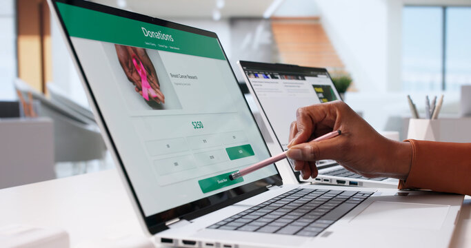 Young Woman Using Online Fundraiser App To Donate Money
