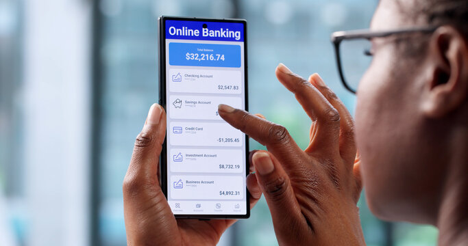 Young African American Woman Checking Account Balance Using Mobile App