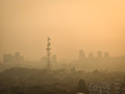 Heavy polluted atmosphere in the city, blurred sky dark with air pollution smoke cloud dust mist for background, problem in atmosphere. Low visibility and High air pollution. Toxic harmful air.