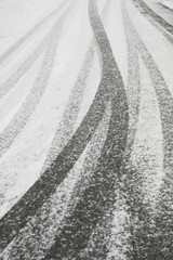 Winter road surface texture with snow and tire tracks