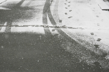Winter road surface texture with snow and tire tracks