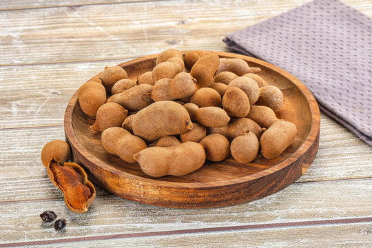 Tropical exotic Tamarind fruit heap