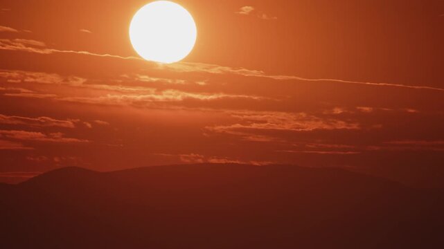 Extreme Closeup of Red Sunset Over a Hill Timelapse