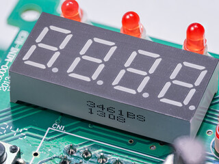 Detail of a turned off display with red LEDs on a printed circuit board.