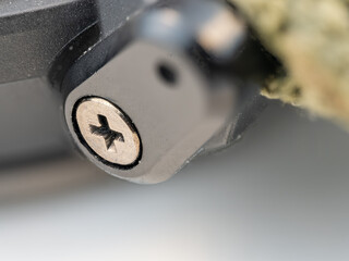 Macro view of a miniature screw on a watch.