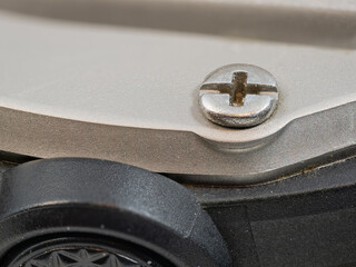 Macro view of a miniature screw on a watch.