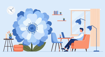 Man works on laptop in room with large blue flower, clock, and lamps