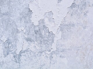 Obraz premium Peeling white paint texture on old concrete wall. Ideal for vintage backgrounds or urban grunge design concepts
