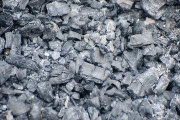 Industrial close up of black coal chunks with rough textured surface