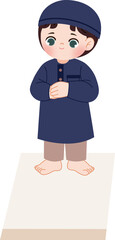 Fototapeta premium cute muslim kid praying on prayer rug